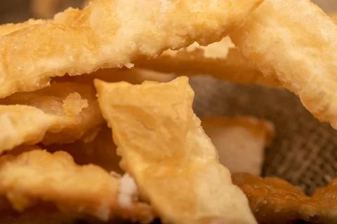 Fried breadsticks with salt, close-up, selective focus. Stock Photos