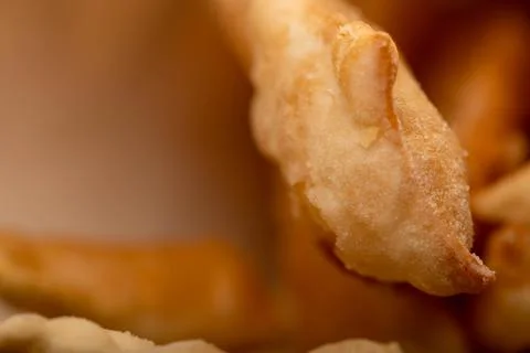 Fried breadsticks with salt, close-up, selective focus. Stock Photos