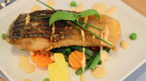 Fried carp fish fillet with vegetables Stock Footage 37727923