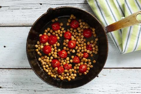 Fried cherry tomatoes with chickpeas Photos