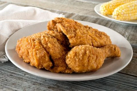 Fried Chicken and Corn on the Cob Stock Photos