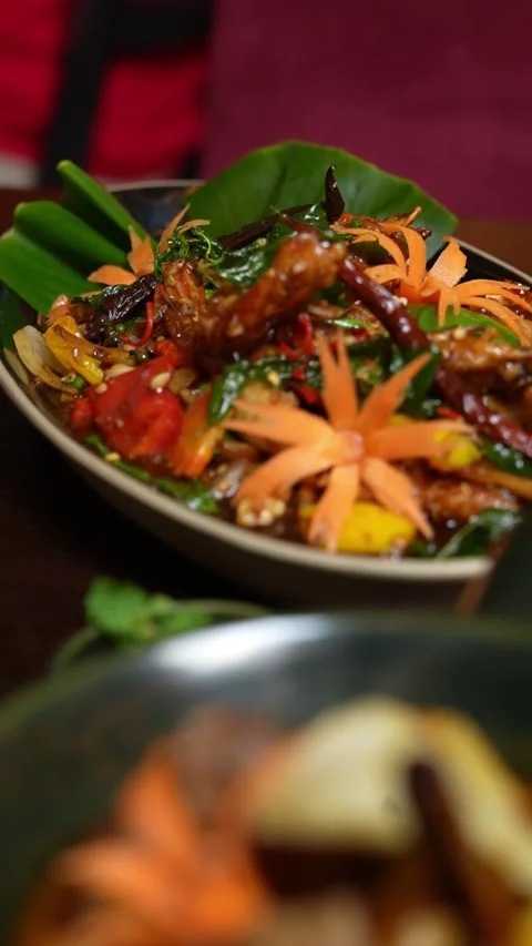 A fried chicken and vegetable dish suitable for restaurant menus Stock Footage 310822927