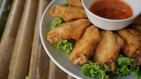 Fried chicken on bamboo table. Stock Photos