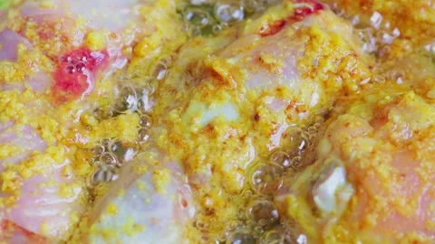 Fried chicken being cooked in hot oil 3 Stock Footage 329836898