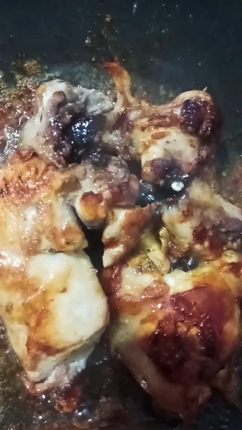 Fried chicken being fried Stock Footage 329411682