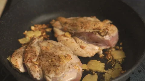 Fried chicken breasts with ginger in a frying pan video Video stock 85756079