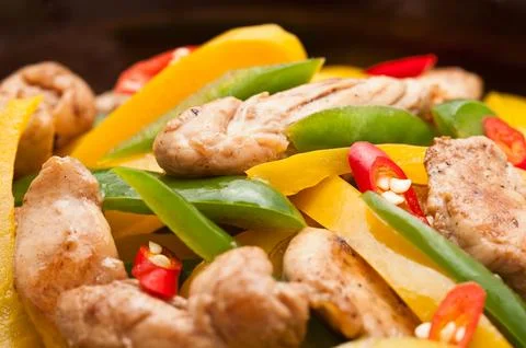 Fried Chicken with capsicum on red table cloth Stock Photos