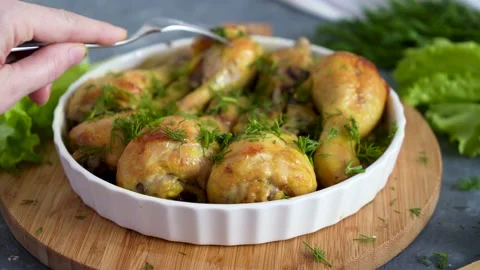 Fried chicken drumstick served in white bawl with green salad and turmeric Stock Footage 168928760