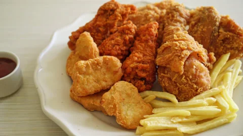 fried chicken with french fries and nugg... | Stock Video | Pond5