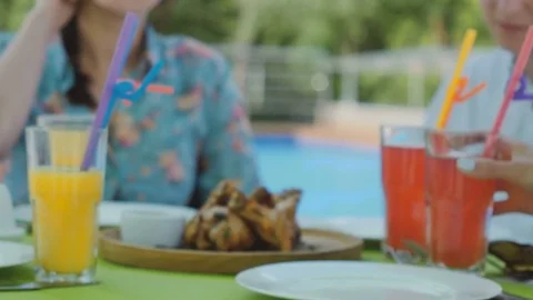 Fried chicken legs at the dish near the pool Stock Footage