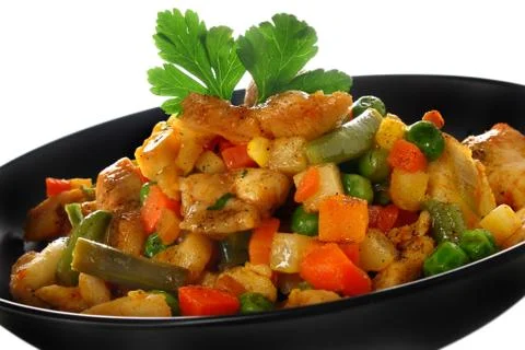 Fried chicken meat with vegetables Stock Photos