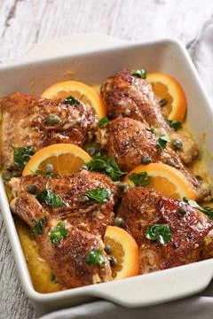 Fried chicken with oranges Stock Photos