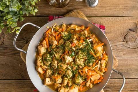 Fried chicken pieces with vegetables. Stock Photos