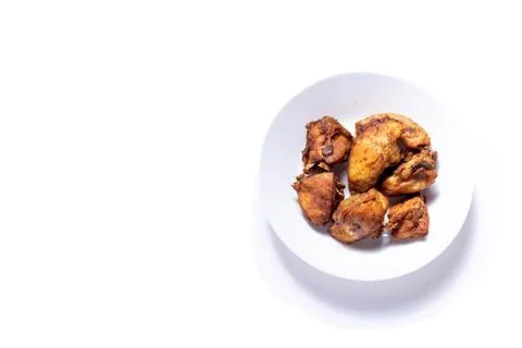 Fried Chicken on a plate with isolated white shot Stock Photos