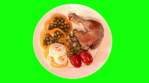 Fried chicken with raw vegetables on plate, top shot Stock Footage 47547842