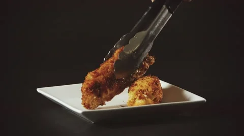 Fried Chicken Rolls being plated Stock Footage 61325259
