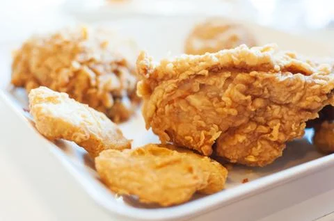 Fried chicken in window lighting Stock Photos