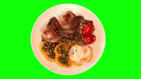 Fried chicken wings with raw vegetables on plate, top shot Stock Footage 47548272