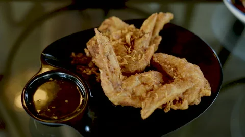 Fried Chicken Wings snacks that are often eaten for fun While waiting Stock Footage 246544084