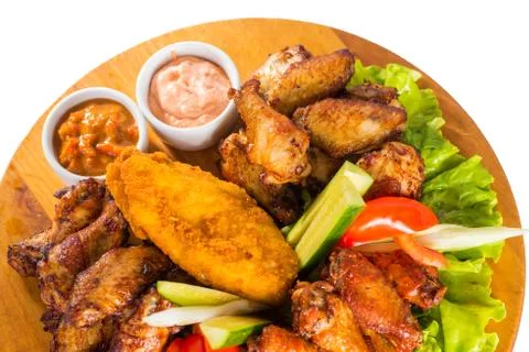 Fried chicken wings with vegetables Stock Photos