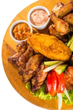 Fried chicken wings with vegetables Stock Photos