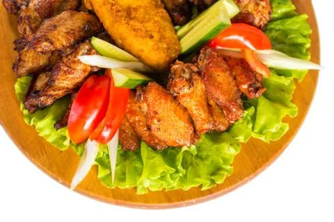 Fried chicken wings with vegetables Stock Photos