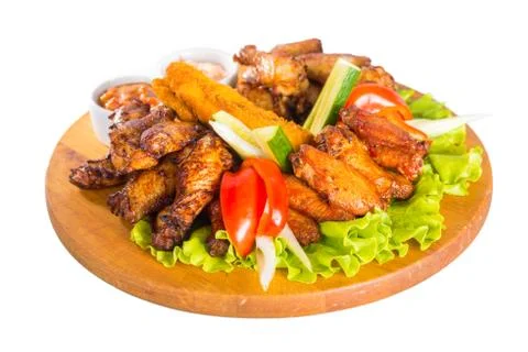 Fried chicken wings with vegetables Stock Photos