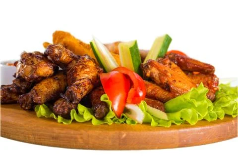 Fried chicken wings with vegetables Stock Photos