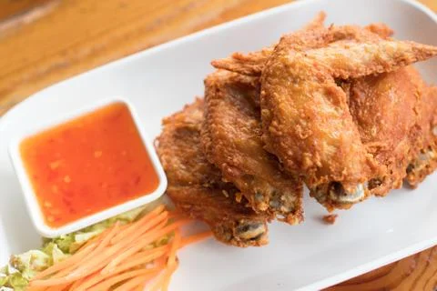 Fried chicken wings on white dish Stock Photos