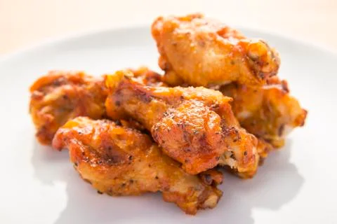 Fried chicken wings on white plate Stock Photos