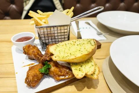Fried Chickens, Crispy Garlic Breads and French Fries Stock Photos