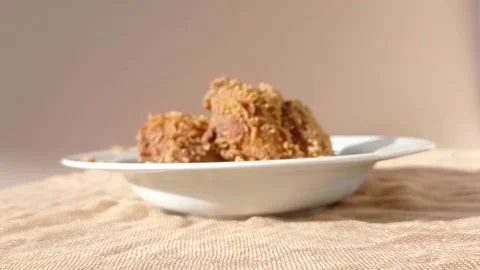 Fried chickens on a white plate Stock Footage 146254052