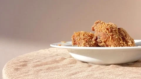 Fried chickens on a white plate Stock Footage 146254084