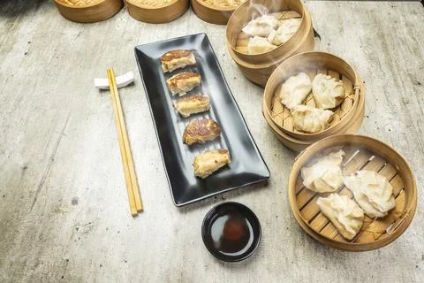 Fried chinese dim sum dumpling, gyoza, jiaozi or mandu in the plate with ch.. Stock Photos