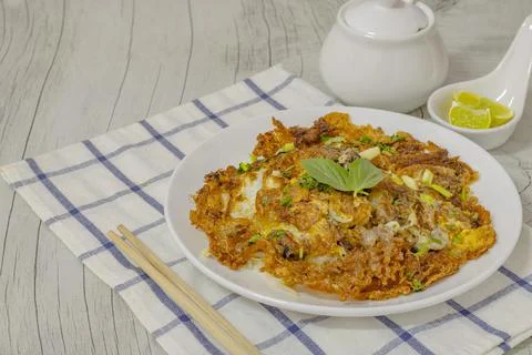 Fried clams mixed with put on a white plate. Stock Photos
