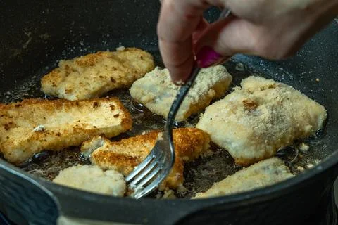 Fried cod, carp, in a glass ovenproof dish, traditional Christmas dishes, s.. Stock Photos