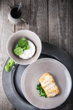 Fried cod fillets and spinach Stock Photos