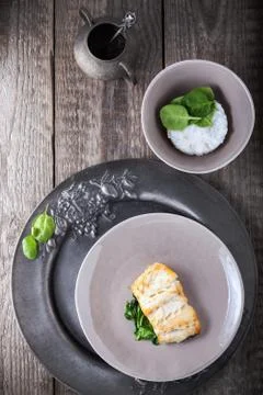 Fried cod fillets and spinach Stock Photos