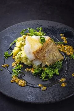 Fried cod fish fillet with vegetable and mached potatoes and passion fruit Stock Photos