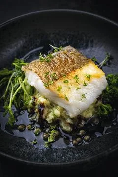 Fried cod fish fillet with vegetable and mached potatoes Stock Photos