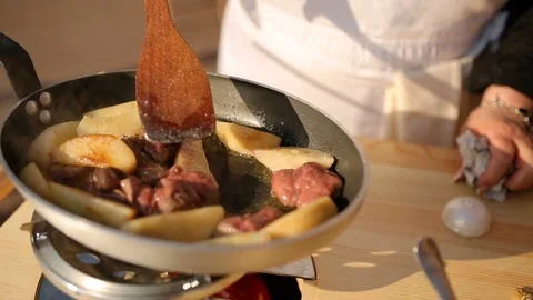 Fried cod liver with pear in a frying pan, close-up Stock Footage 91270255