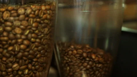 Fried coffee beans in a flask of a coffee grinder. Stock Footage 85815141