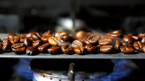 Fried coffee beans with smoke. Close up. Stock Footage 60996715