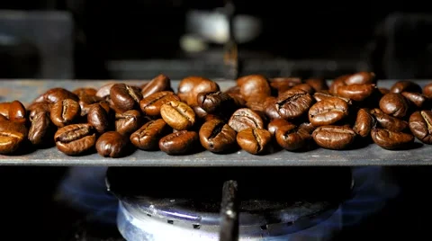 Fried coffee beans with smoke. Close up. Stock Footage 60996783