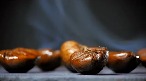 Fried coffee beans with smoke. Close up. Stock Footage 60996839