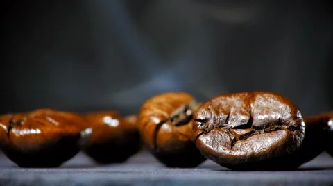 Fried coffee beans with smoke. Close up. Stock Footage 60997006