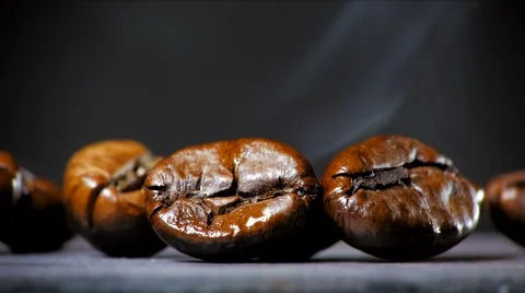 Fried coffee beans with smoke. Close up. Stock Footage 60997215