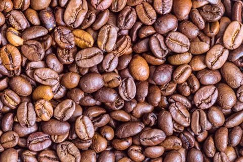 Fried coffee beans texture close-up Stock Photos