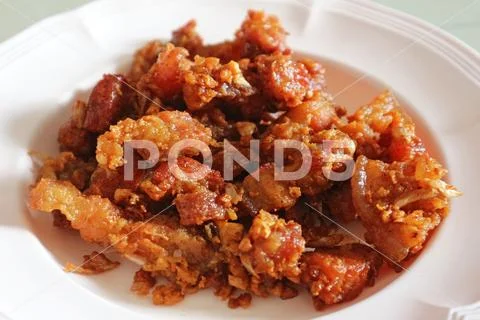 Fried Crispy Pork Belly on the White Plate - Traditional Thai Food Stock Photos