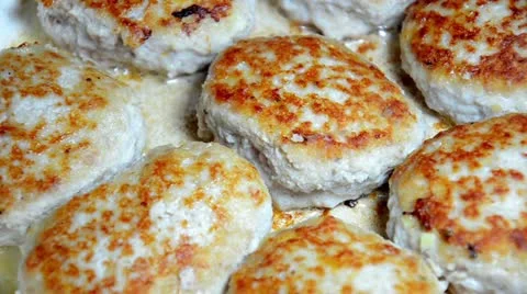 Fried cutlets on a frying pan Stock Footage 12330415